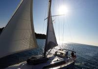 sailing yacht sun through sails of sailing yacht sea